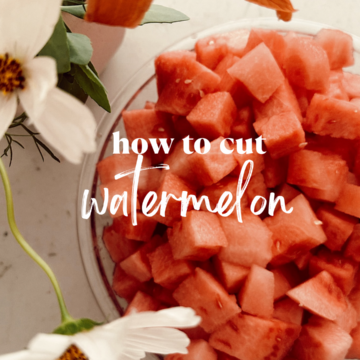 bowl of watermelon on quartz counters with flowers