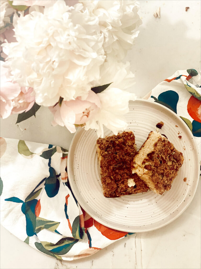 sourdough discard coffee cake on counter with flowers